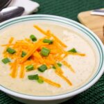 creamy baked potato soup with cheddar cheese and green onions
